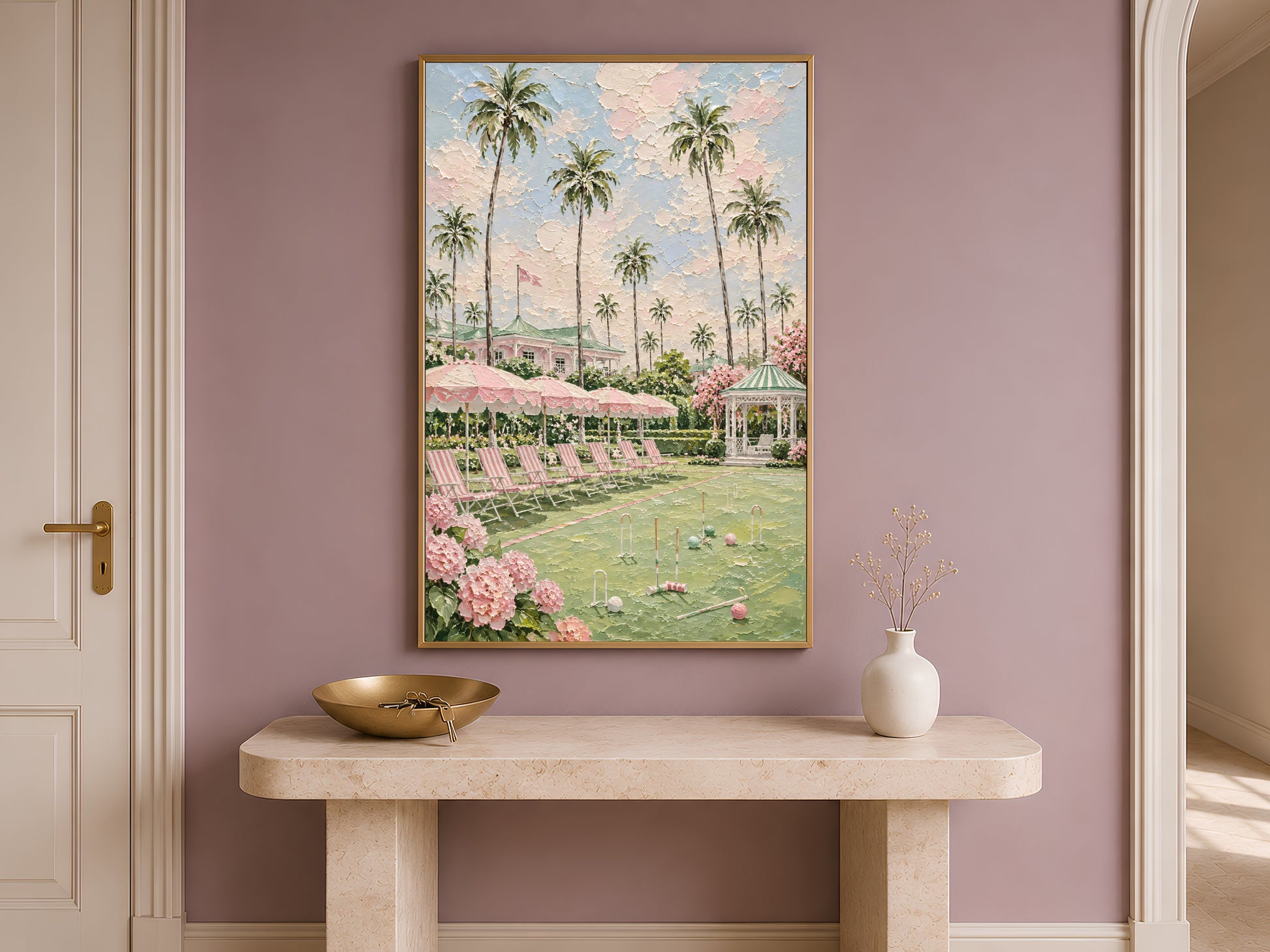 Pink preppy resort painting framed on an entryway wall above a console table
