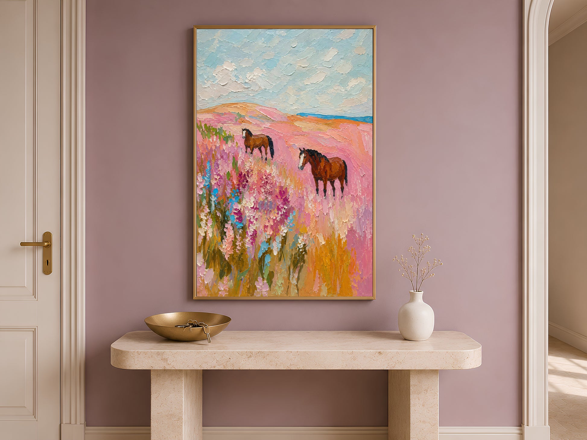 Pink wildflower horse painting framed on an entryway wall above a console table