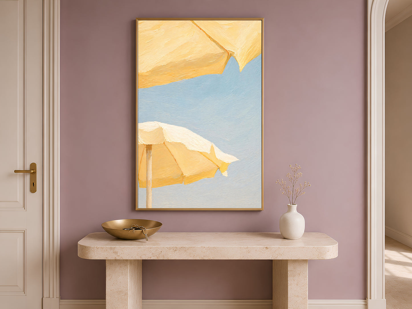 Butter yellow beach umbrella print framed on an entryway wall above a console table