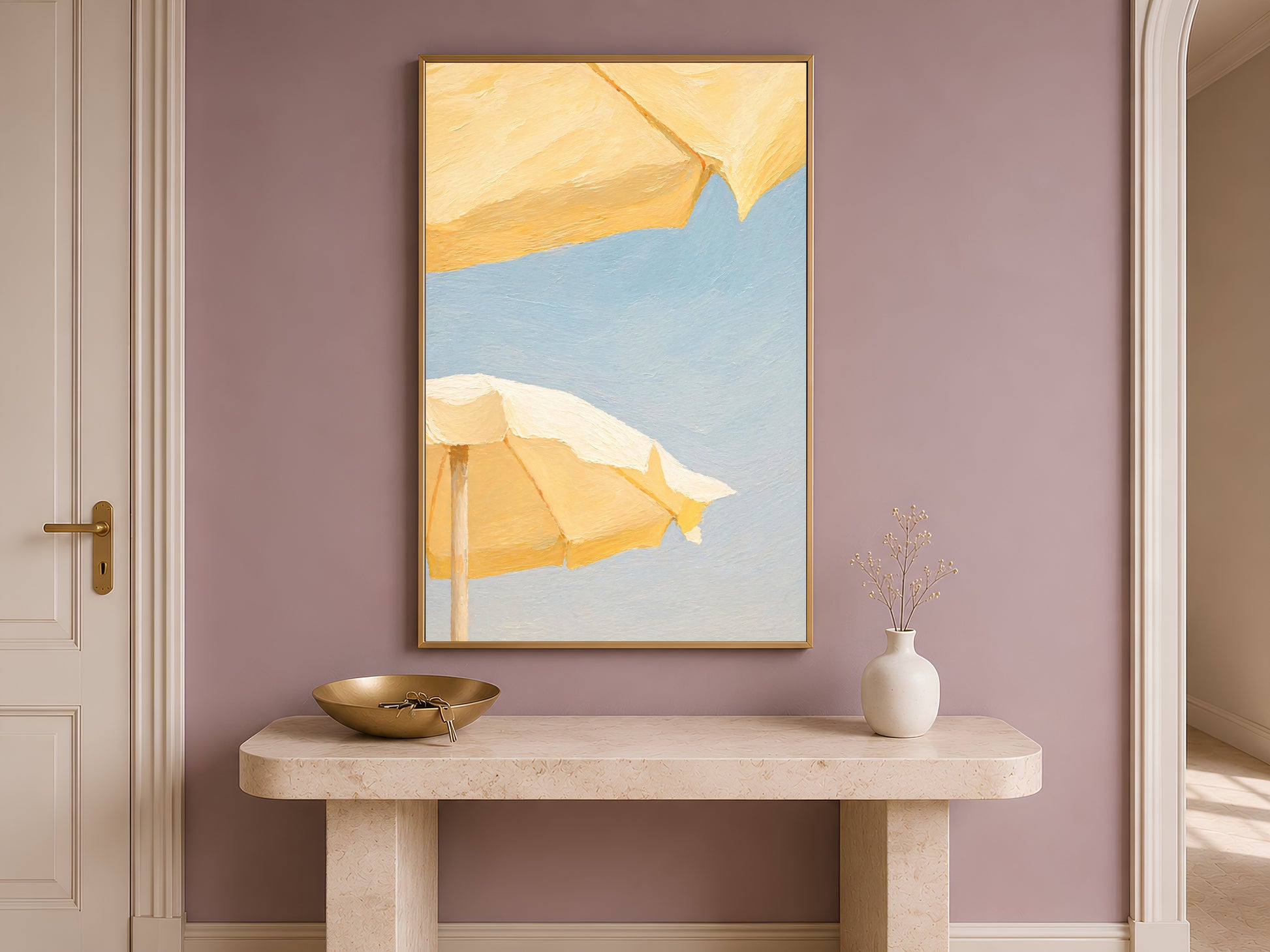 Butter yellow beach umbrella print framed on an entryway wall above a console table