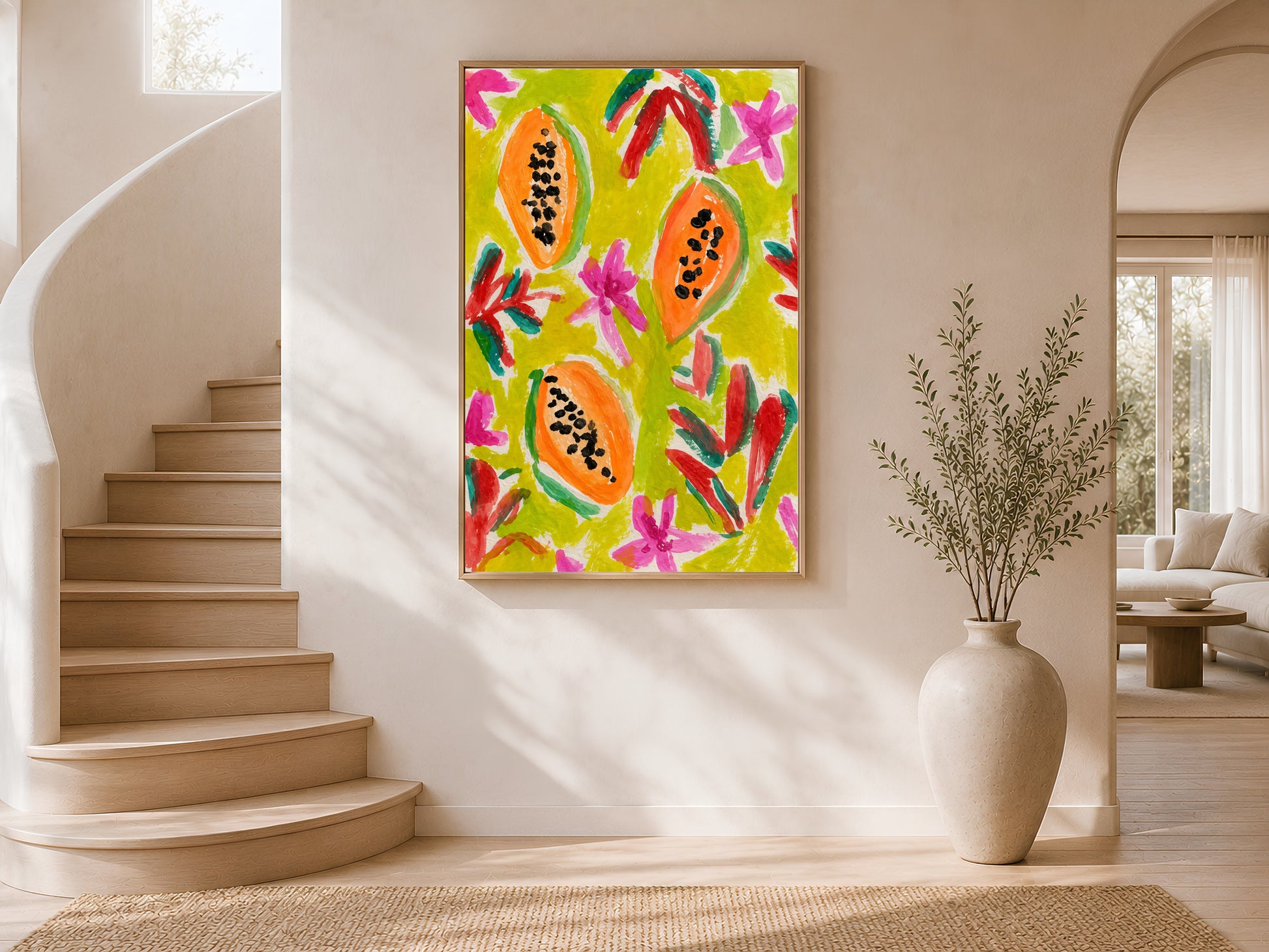 Colorful papaya print in a gold frame on a curved staircase wall with warm white plaster finish and arched window with natural light
