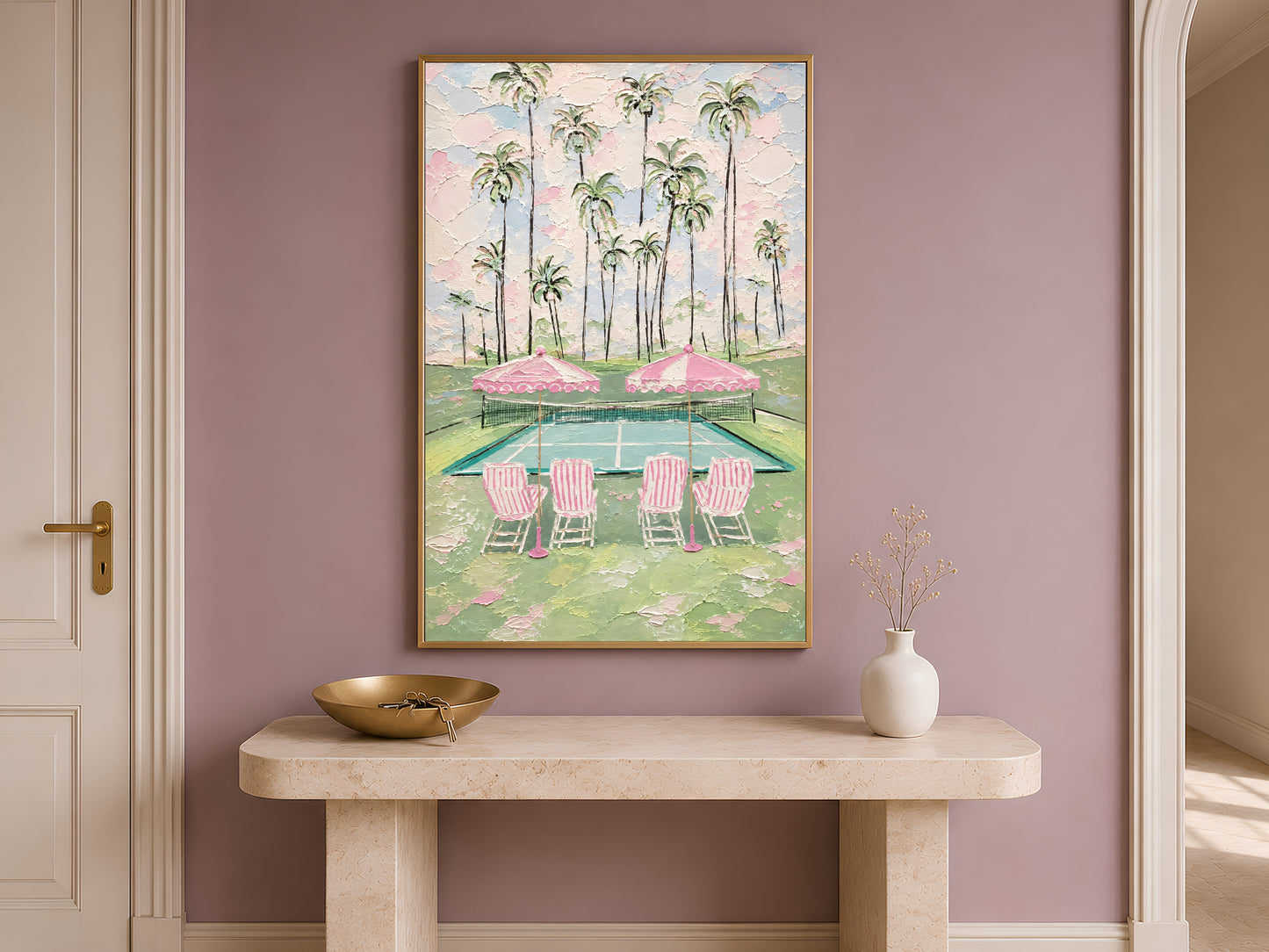 Pink tennis court wall art in gold frame on console table in hallway with mauve accent wall
