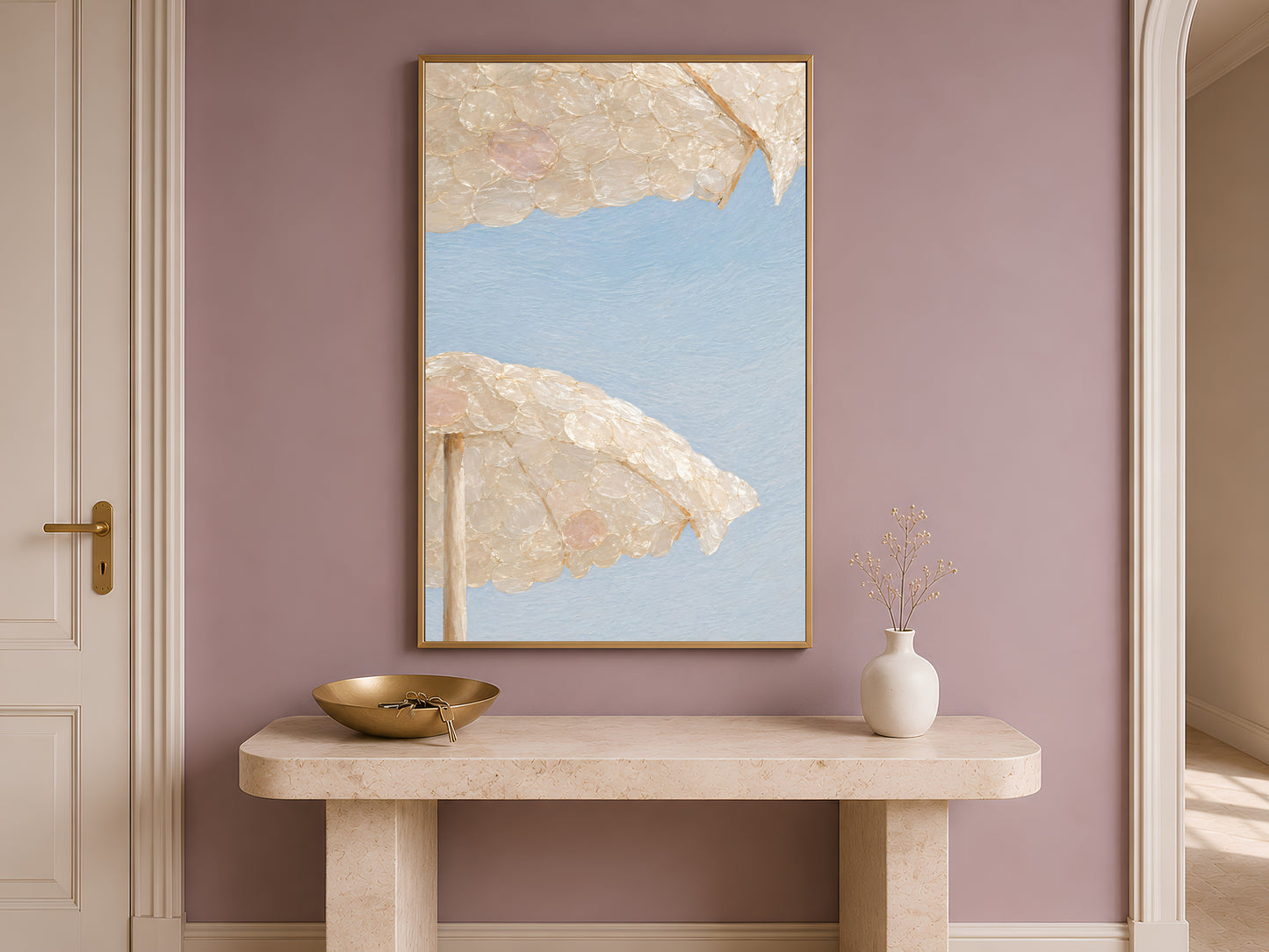 Capiz shell beach umbrella print framed on an entryway wall above a console table
