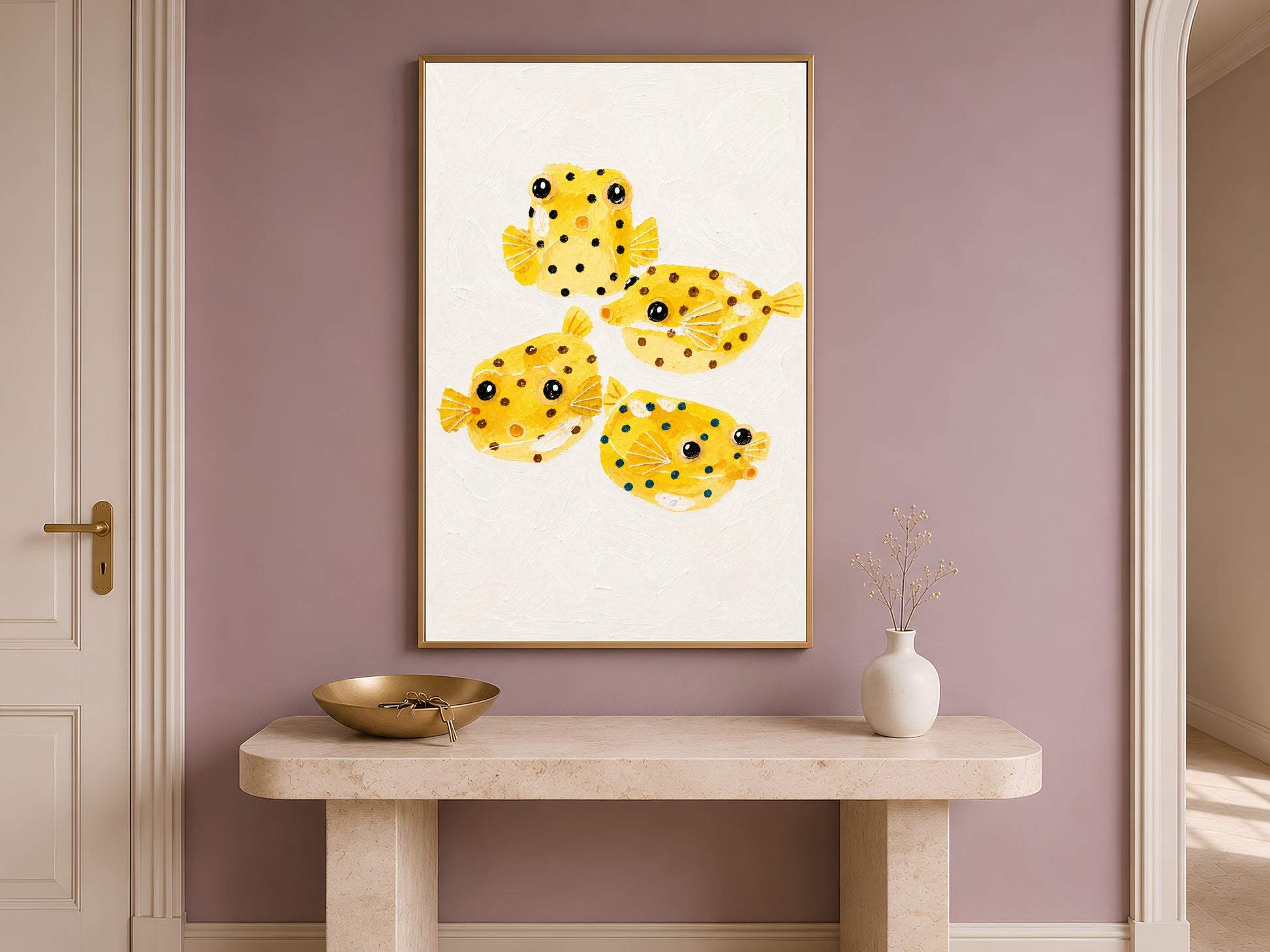 Yellow boxfish painting framed on an entryway wall above a wooden table
