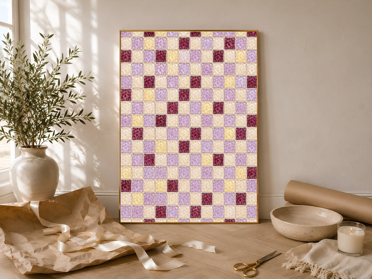 Framed mosaic tile print styled in a flat lay with a ceramic vase and olive branch
