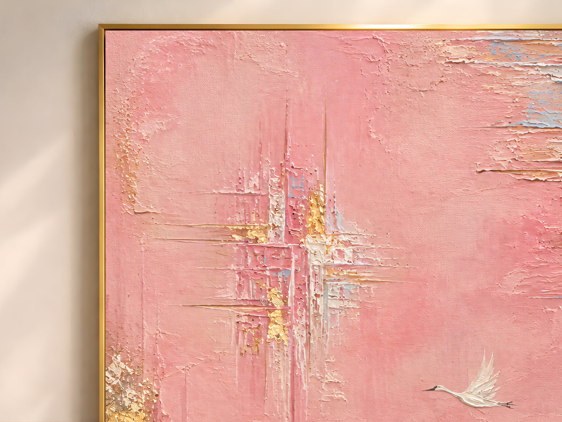Close-up of pink and gold abstract wall art print showing impasto gold leaf texture, crane bird painting detail
