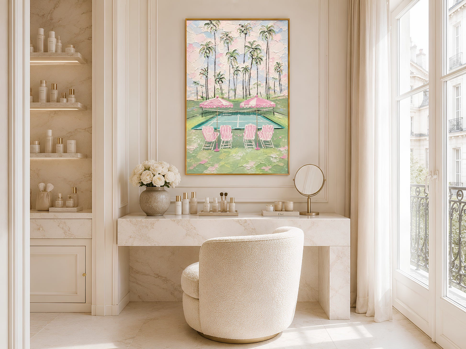 Gold-framed pink tennis court and palm tree wall art in a bright minimalist bathroom beside a freestanding white bathtub with gold taps and open shelving

