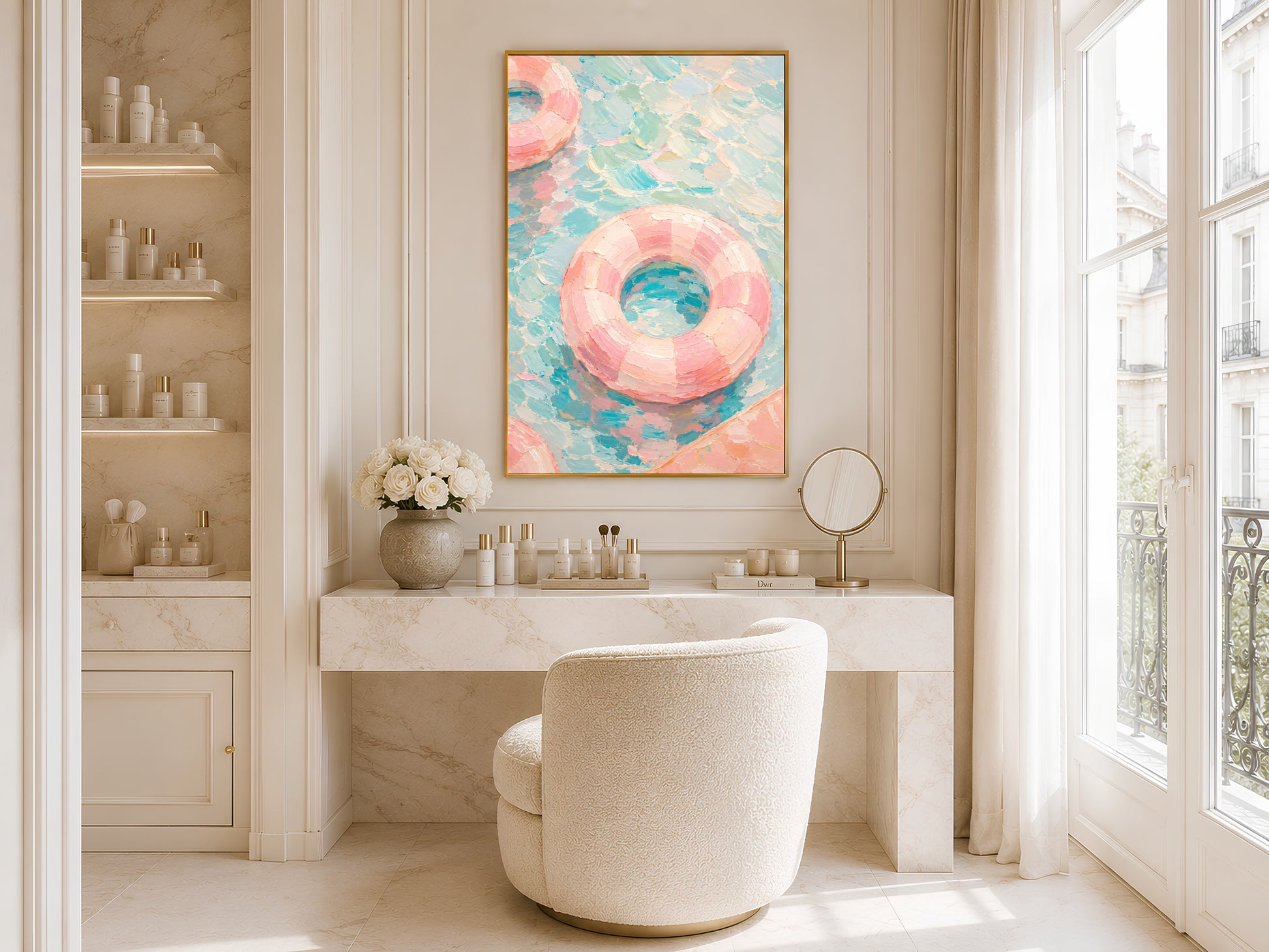 
Pool float wall art in gold frame above a bathroom vanity in a bright minimal neutral bathroom with round mirror