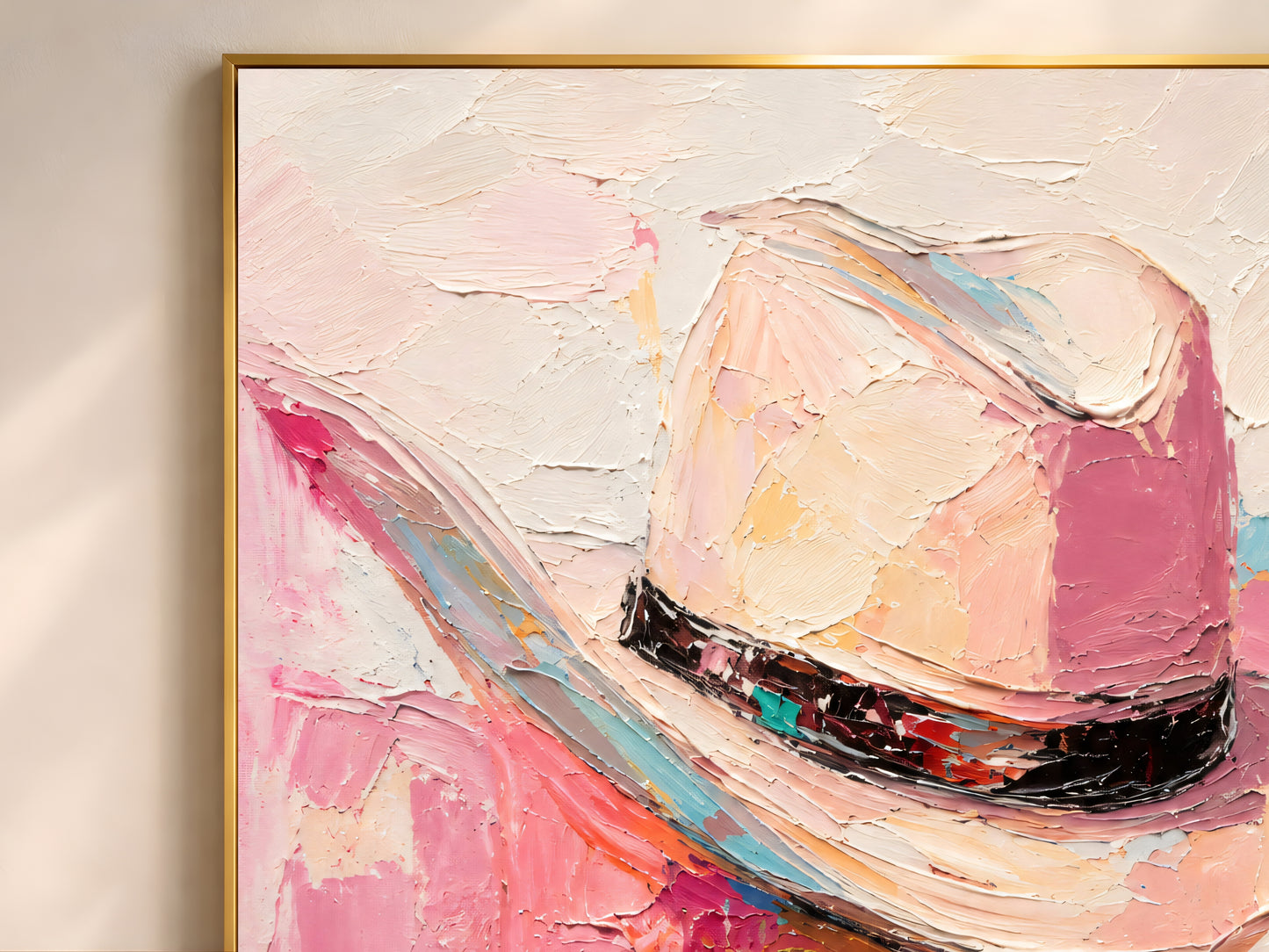 Close-up of impasto cowgirl hat wall art showing thick brushwork in hot pink, blush, and black band detail
