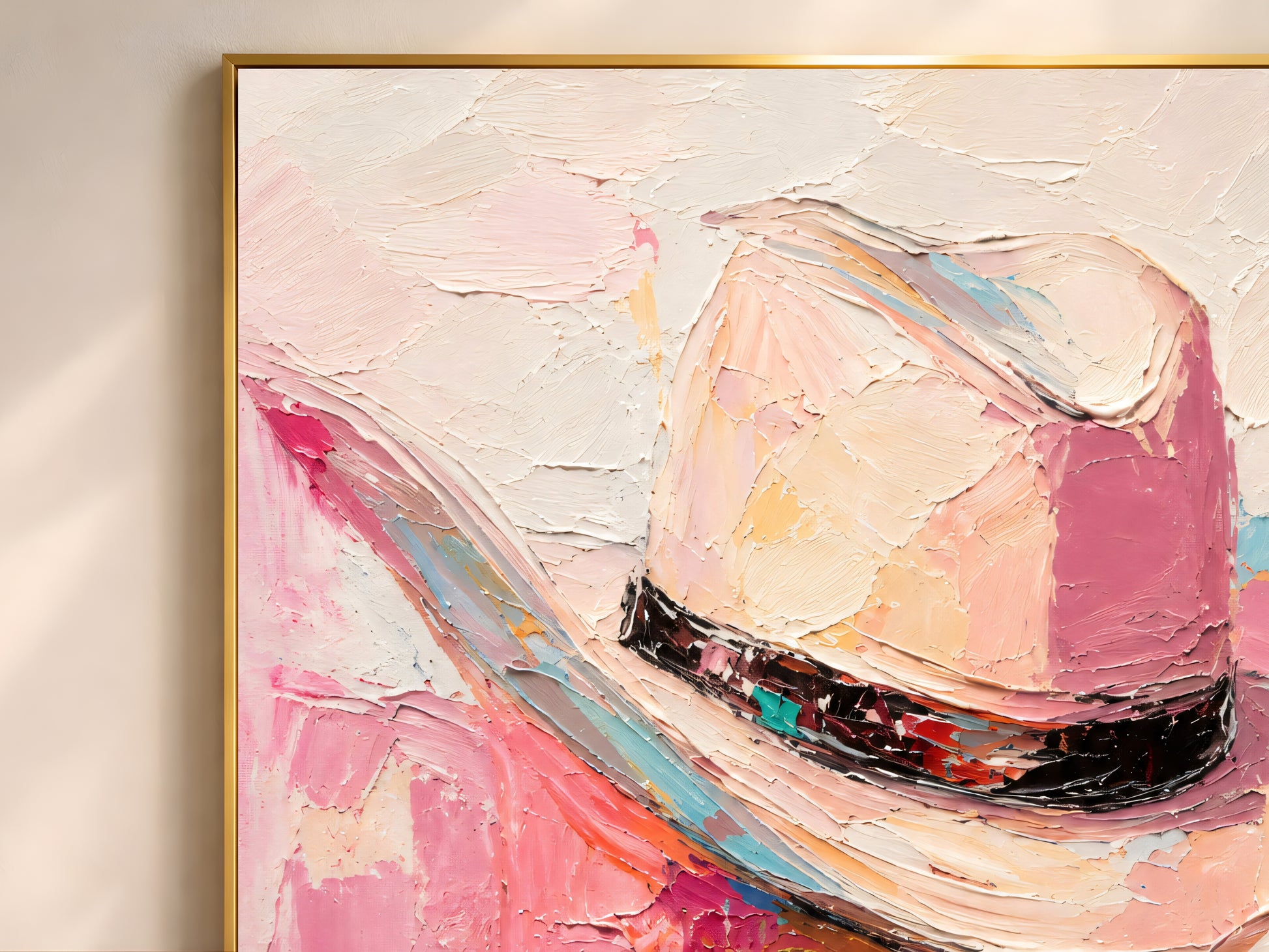 Close-up of impasto cowgirl hat wall art showing thick brushwork in hot pink, blush, and black band detail
