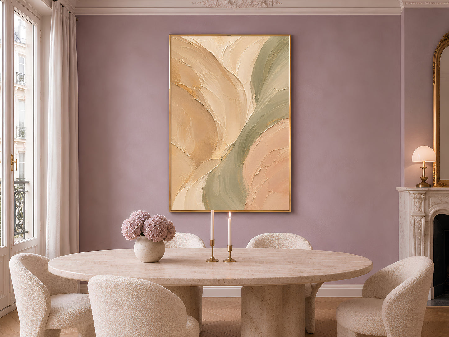 Sage green beige abstract print in gold frame on mauve wall above round dining table with candles and vase
