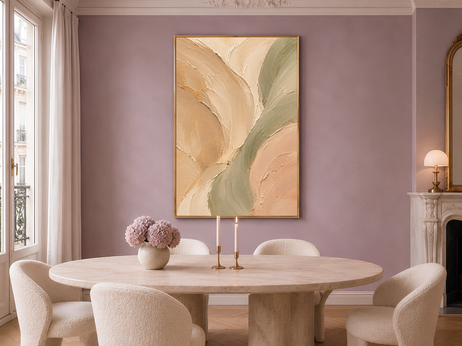 Sage green beige abstract print in gold frame on mauve wall above round dining table with candles and vase
