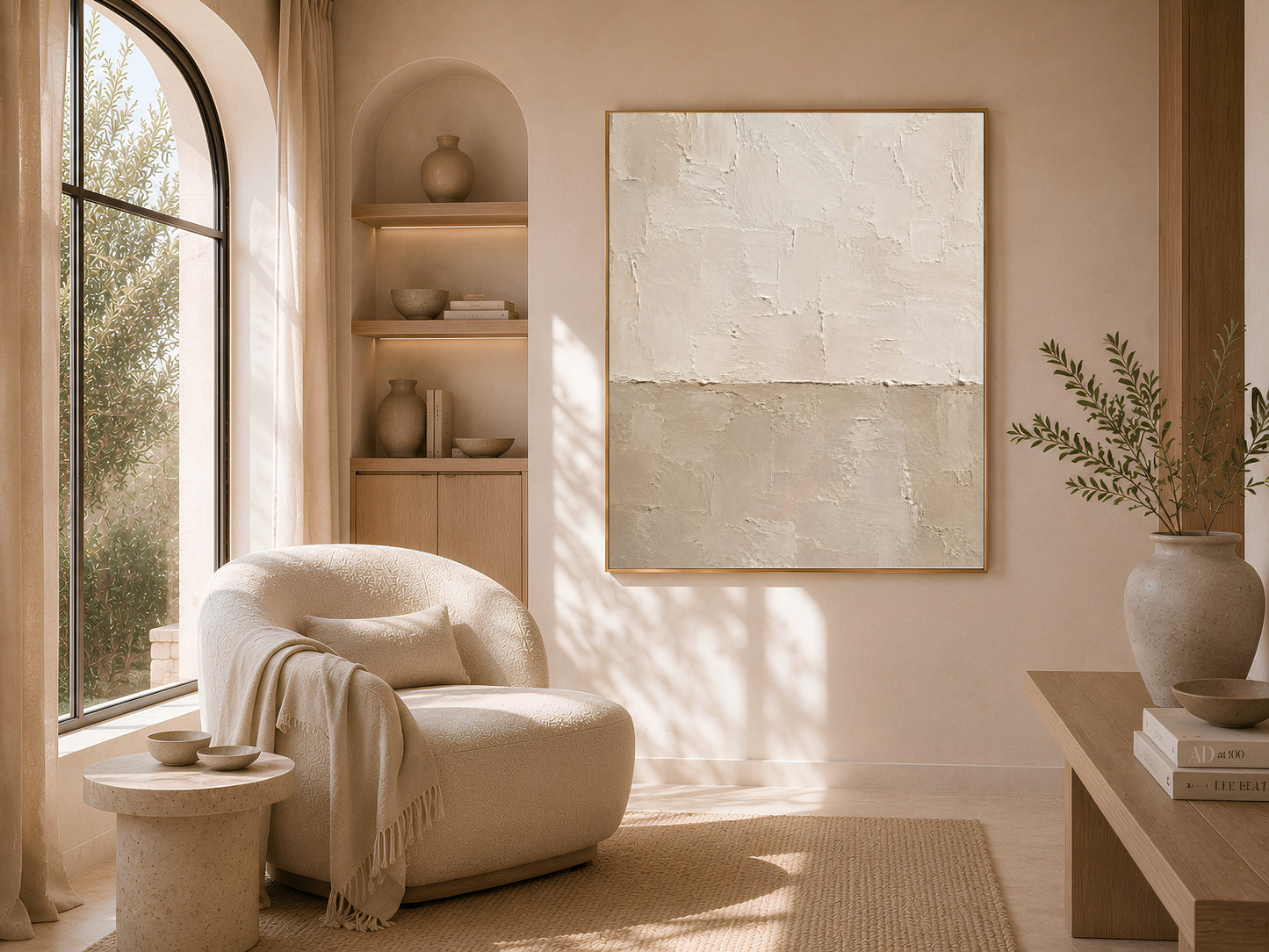 Neutral plaster texture wall art framed above a curved boucle sofa in a warm minimalist living room
