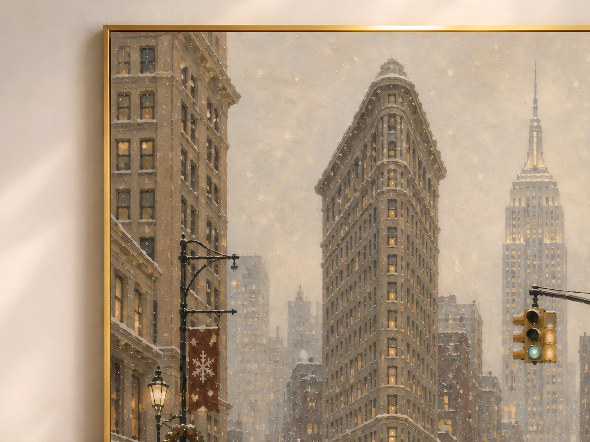 Close-up detail of framed Flatiron Building oil painting print with snowy 5th Avenue skyline