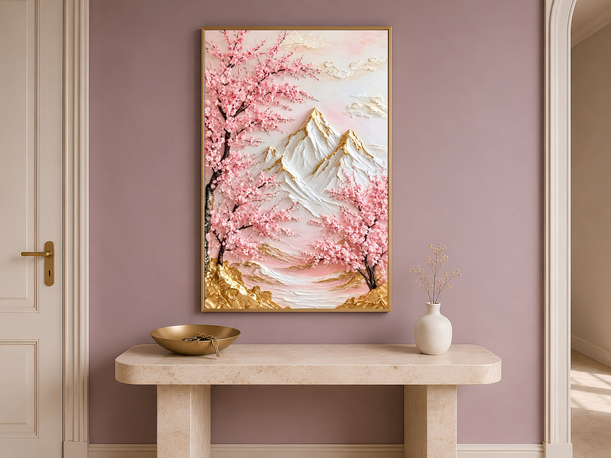 Cherry blossom mountain print in a gold frame on a console table in a warm-toned entryway