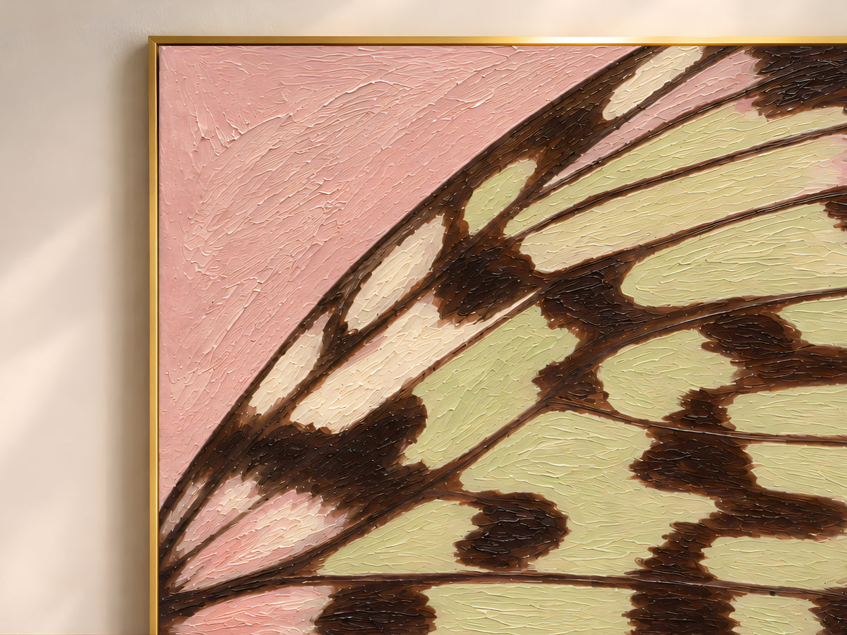 Close-up of textured impasto butterfly wing print showing raised brushstroke detail in a thin gold frame