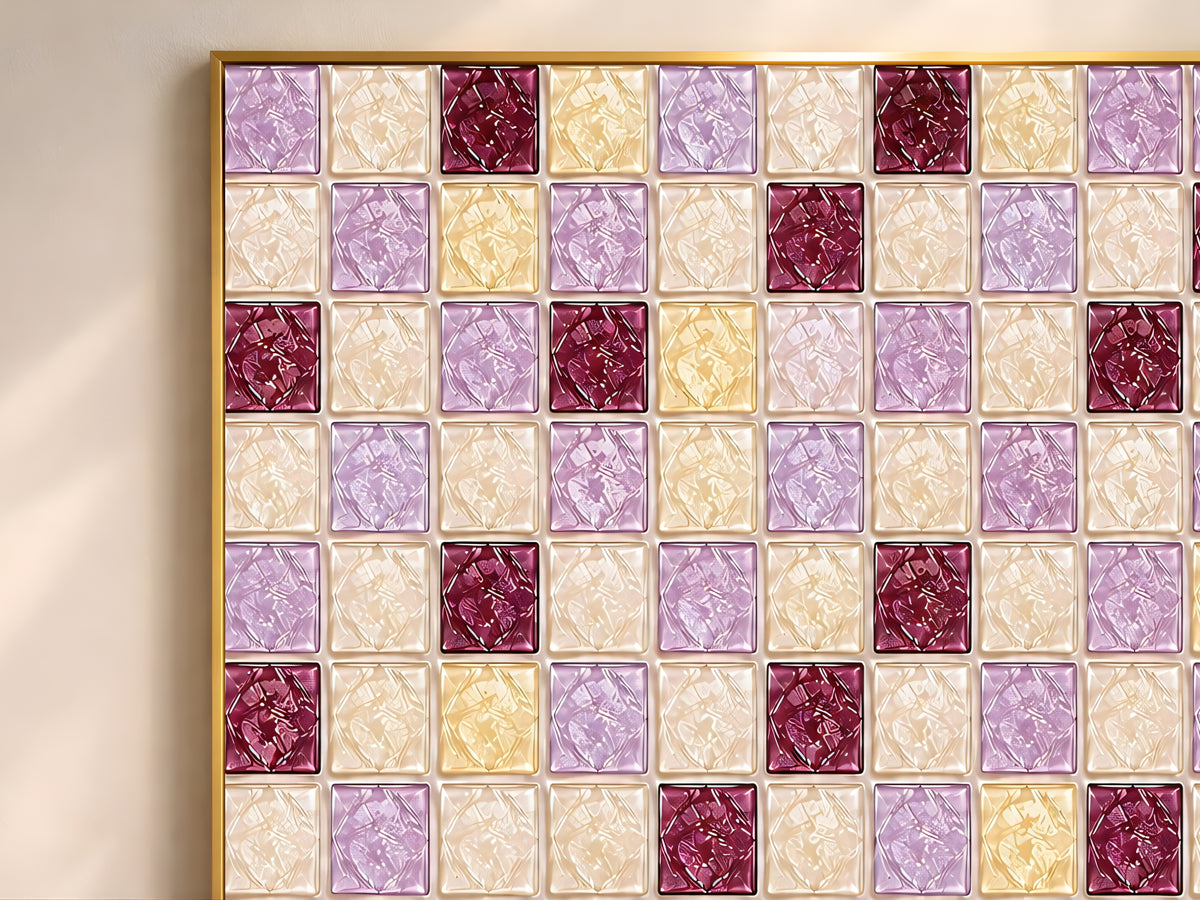 Close-up of geometric mosaic wall art in amethyst purple, burgundy, and champagne gold glass-tile pattern