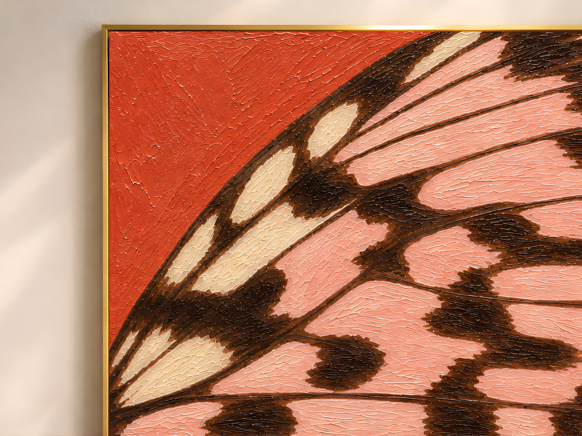 Close-up of textured impasto butterfly wing print in tomato red and pink showing raised brushstroke detail