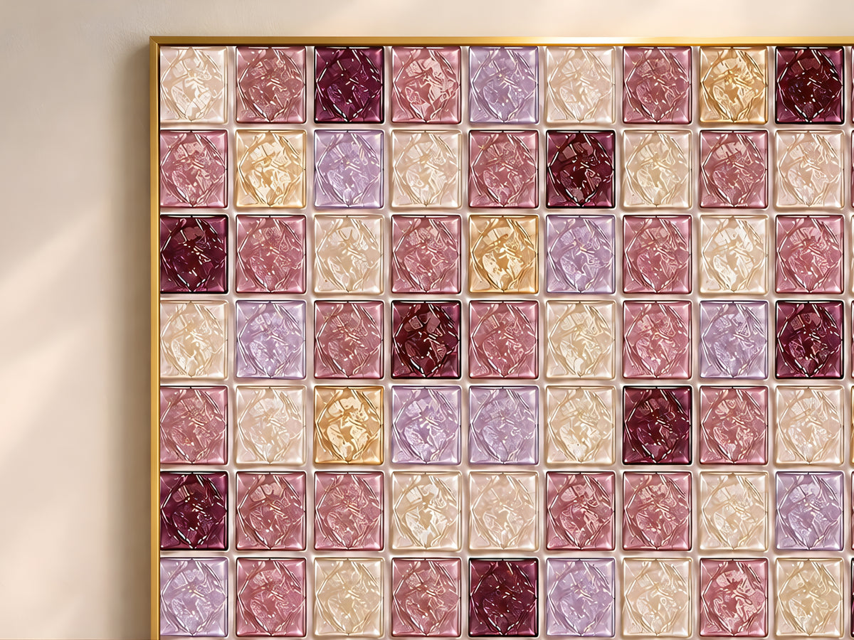 Close-up of geometric mosaic wall art in wine burgundy, lilac, gold, and cream glass-tile pattern