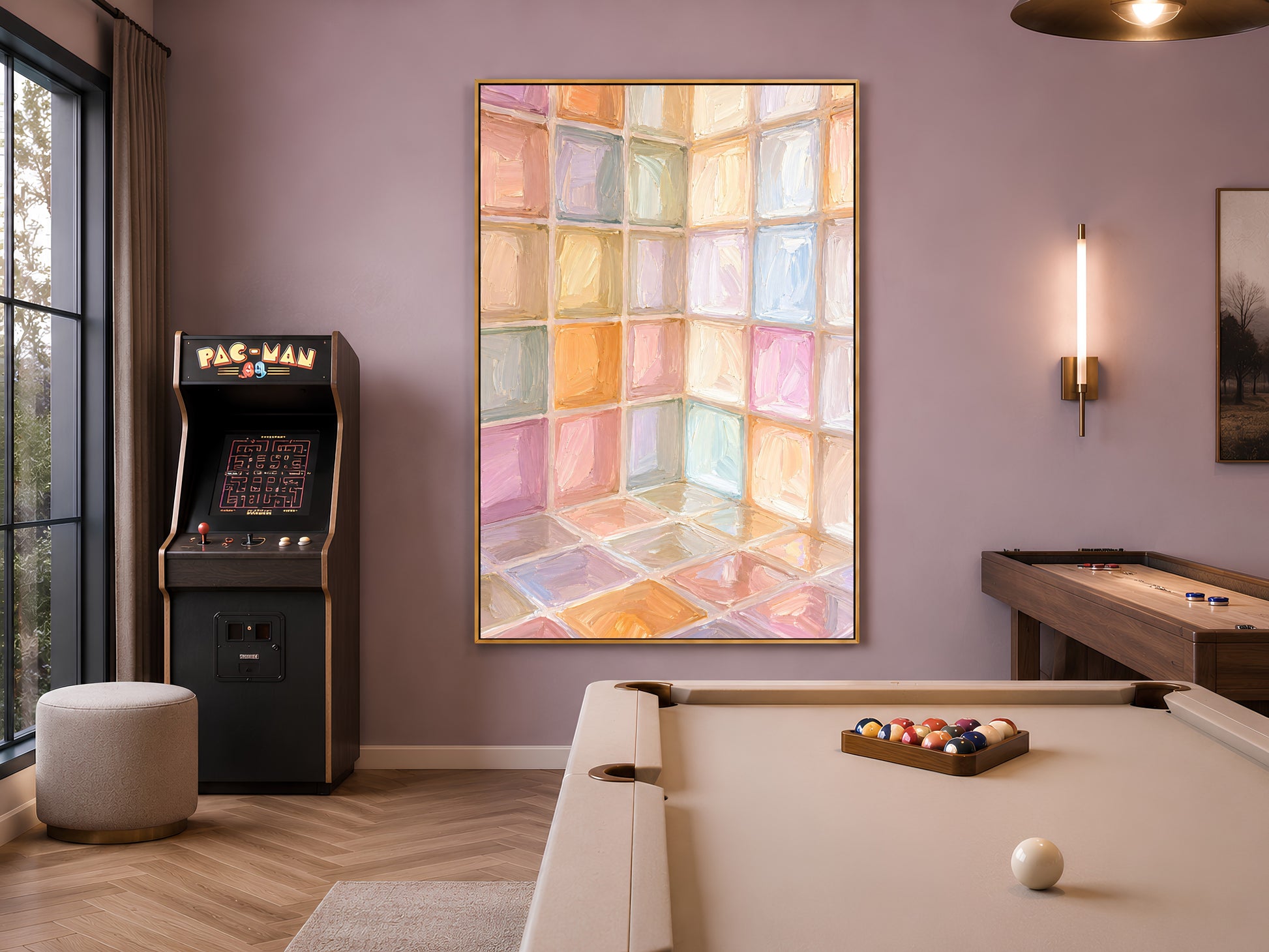 Rainbow pastel mosaic tile wall art in gold frame in moody games room with arcade machine and pool table lighting

