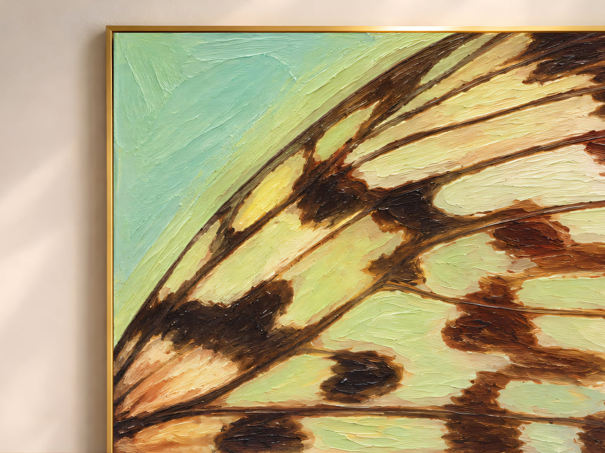 Close-up of textured impasto butterfly wing print in teal and amber gold showing raised brushstroke detail