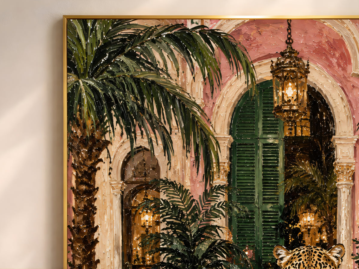 Close-up of the leopard Christmas painting showing the velvet bow, palm trees, and glowing palazzo archway