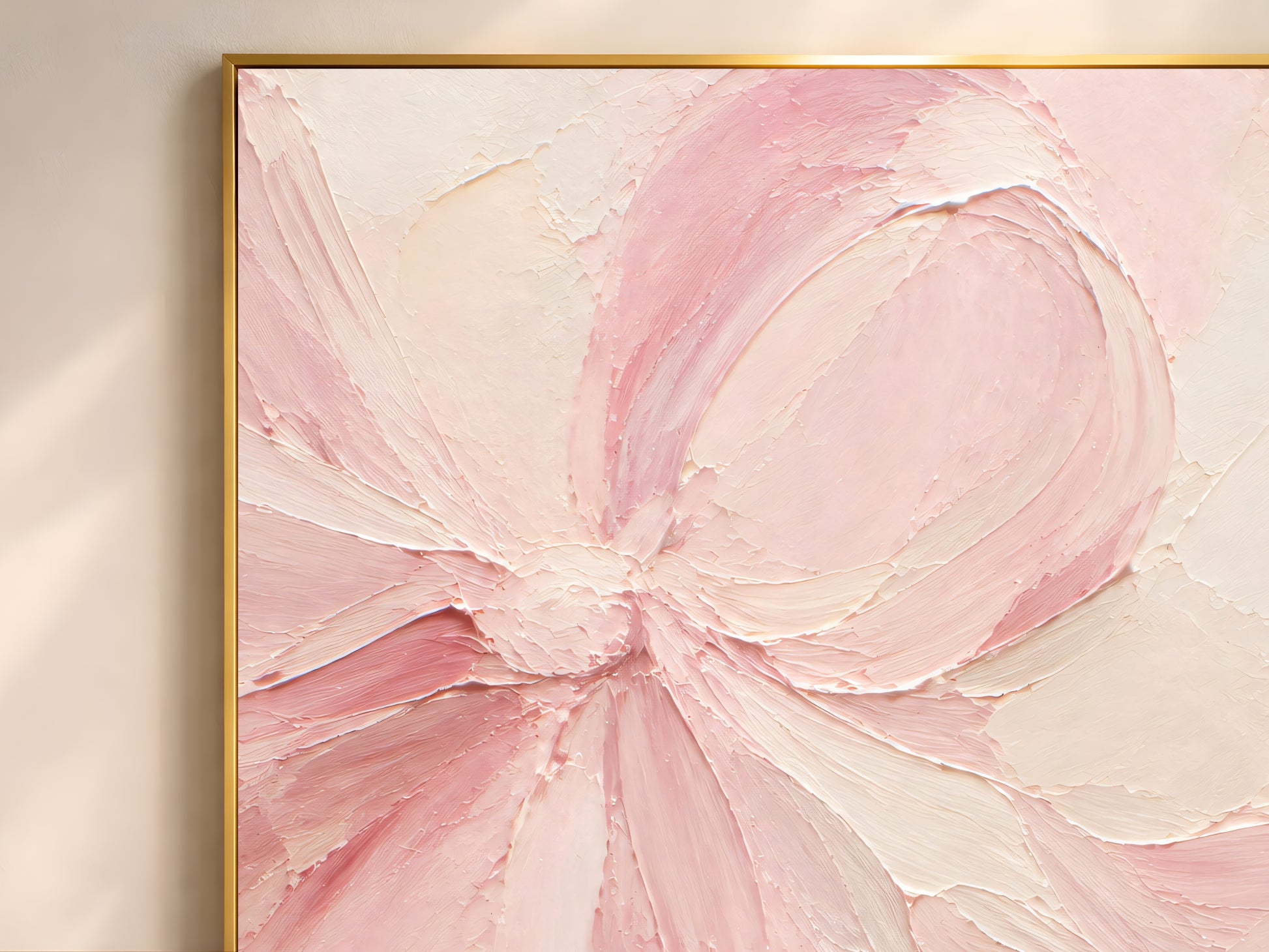 Close-up of thick impasto brushstrokes in blush pink and cream on a bow painting