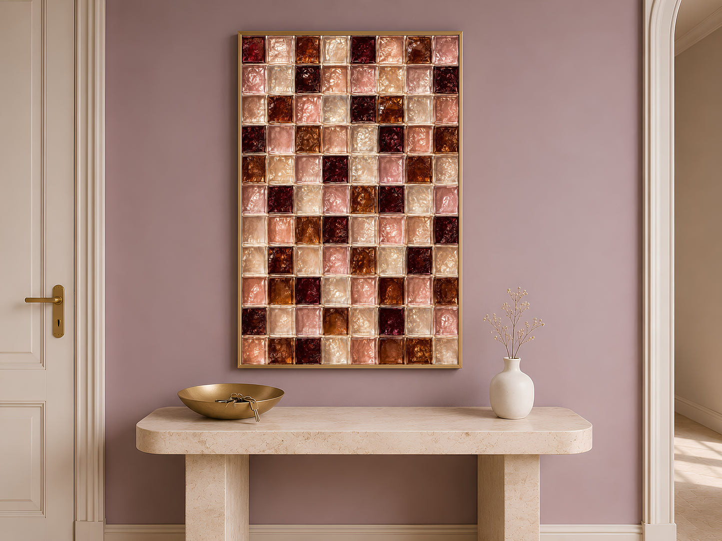 Wine red and blush tile wall art framed above a console table by an arched doorway