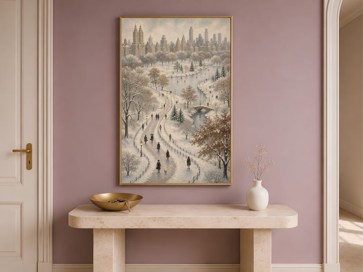 Central Park winter wall art framed print displayed above console table on mauve pink wall