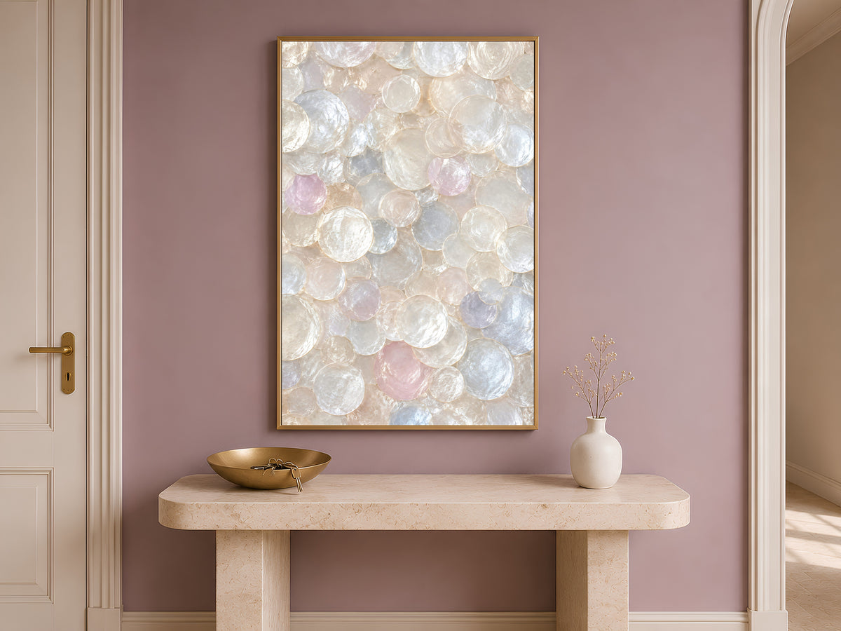 Iridescent capiz shell wall art framed above a wooden console table in a hallway entryway