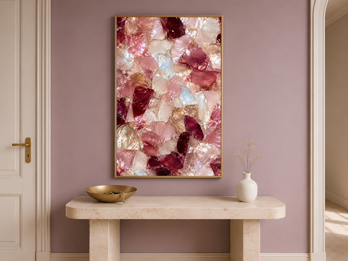 Pink crystal wall art framed above a wooden console table in a hallway entryway