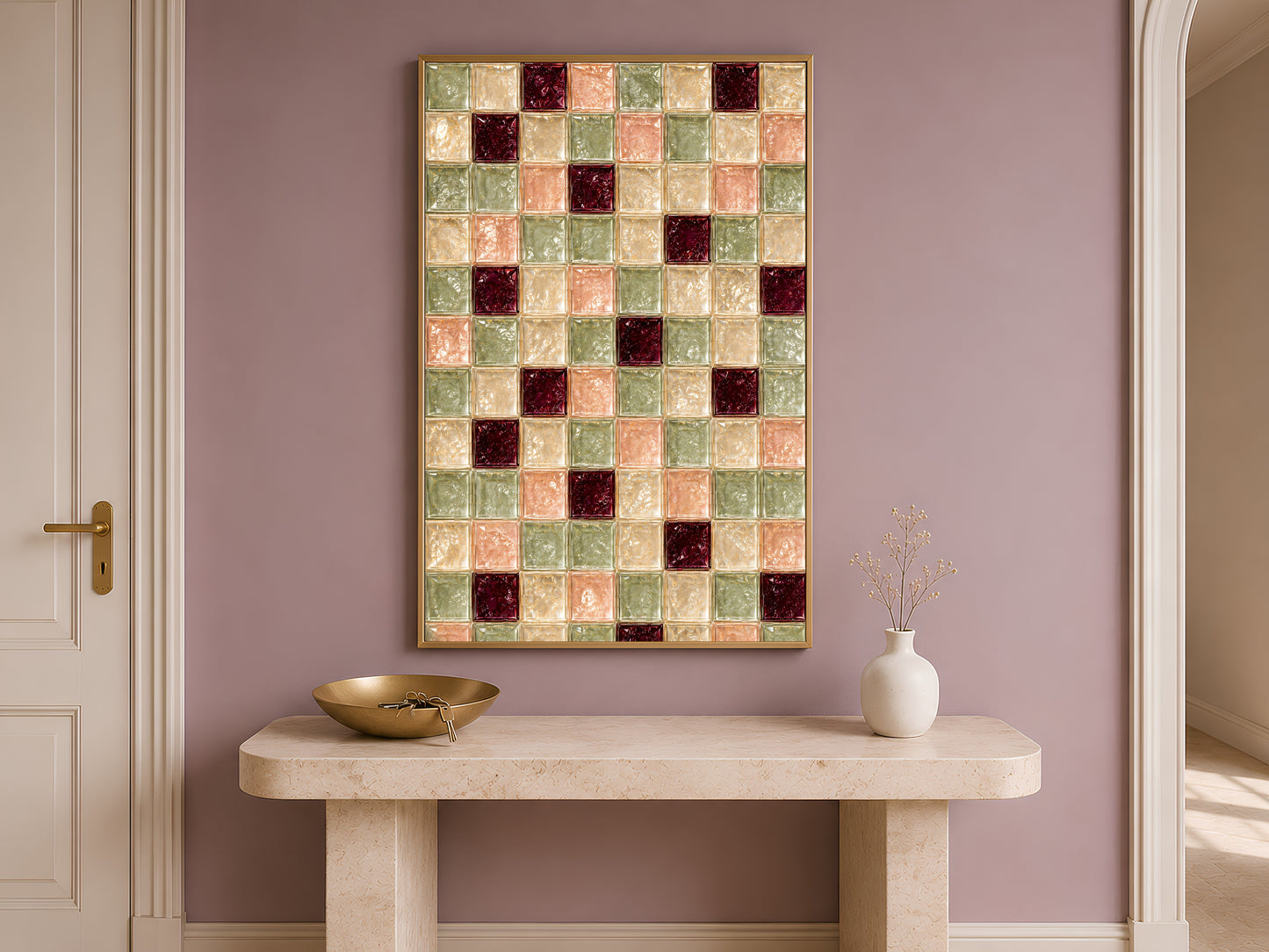 Sage green tile art framed above a console table against a mauve wall