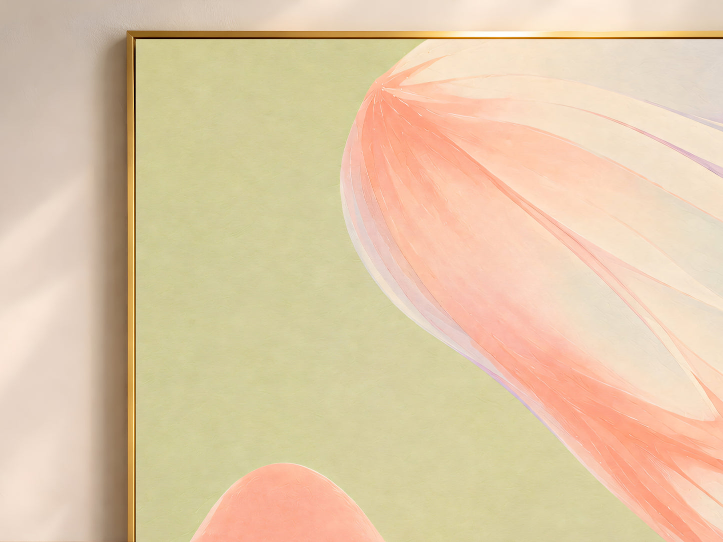 Close-up of sage green abstract ribbon print in a thin gold frame on an olive green wall
