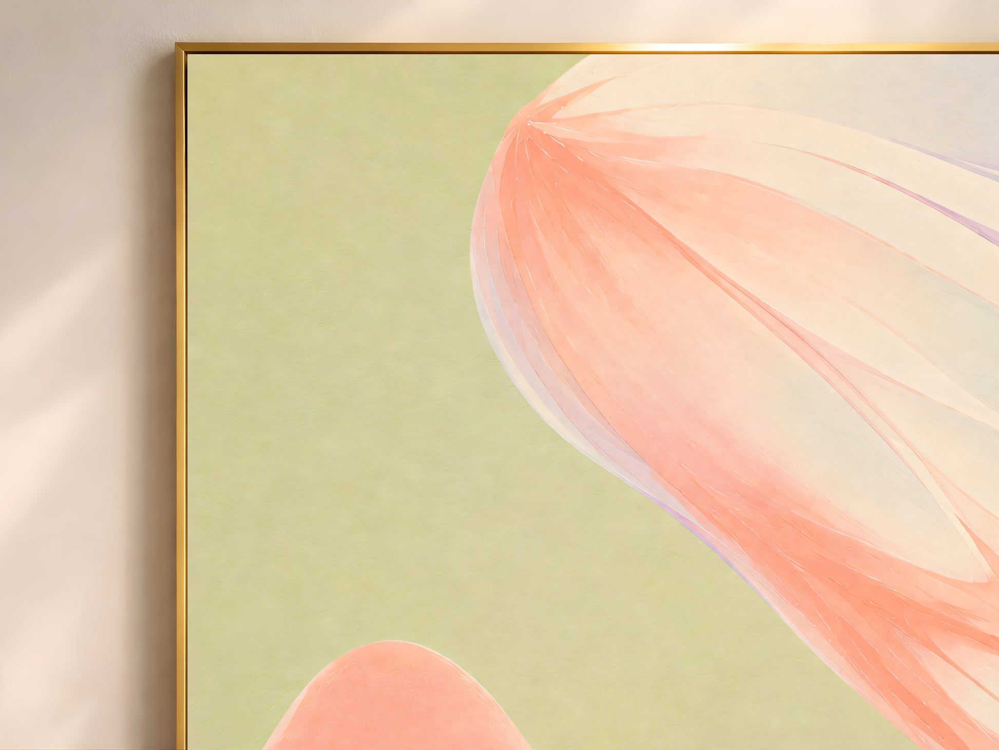 Close-up of sage green abstract ribbon print in a thin gold frame on an olive green wall

