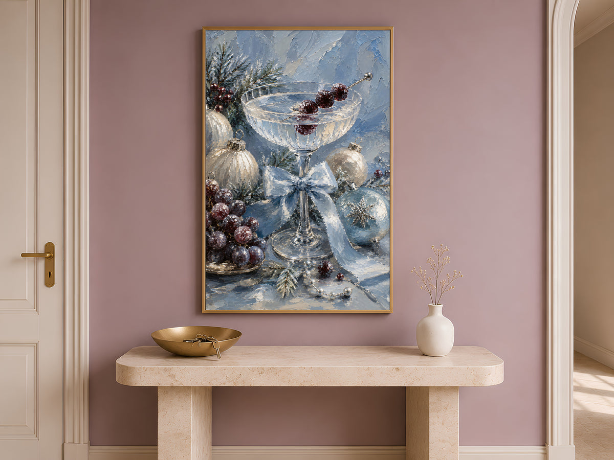 Silver blue holiday print framed above a wooden console table in a hallway entryway