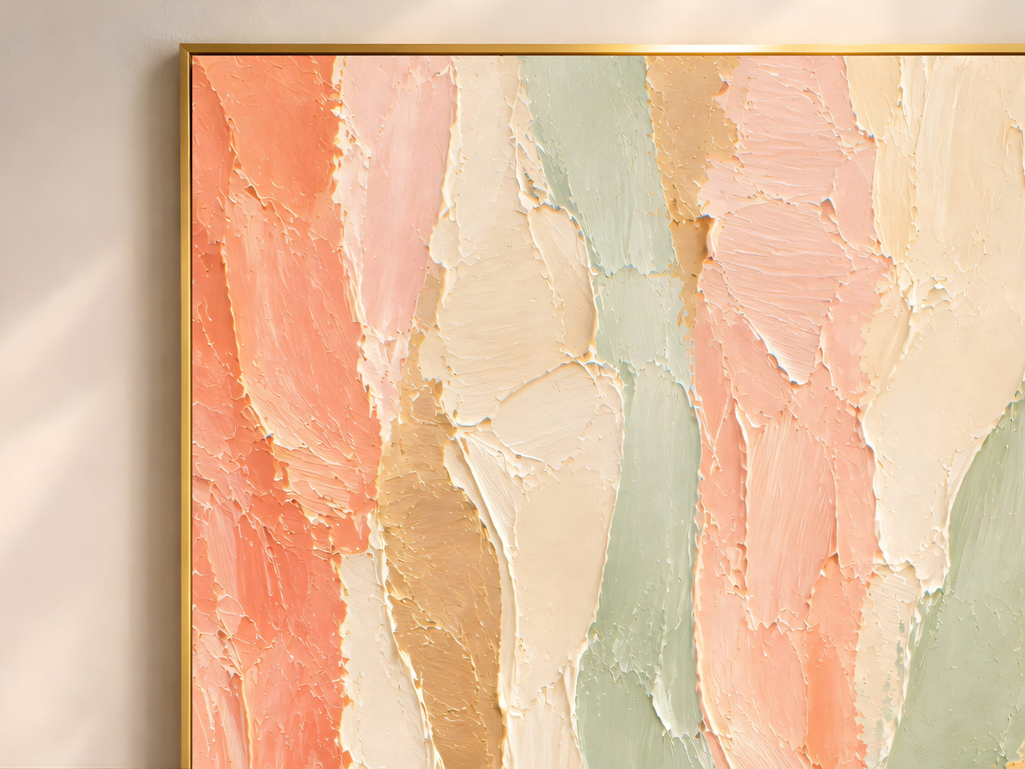 Close-up of thick impasto brushstrokes in coral, sage green, cream, and gold on an abstract painting