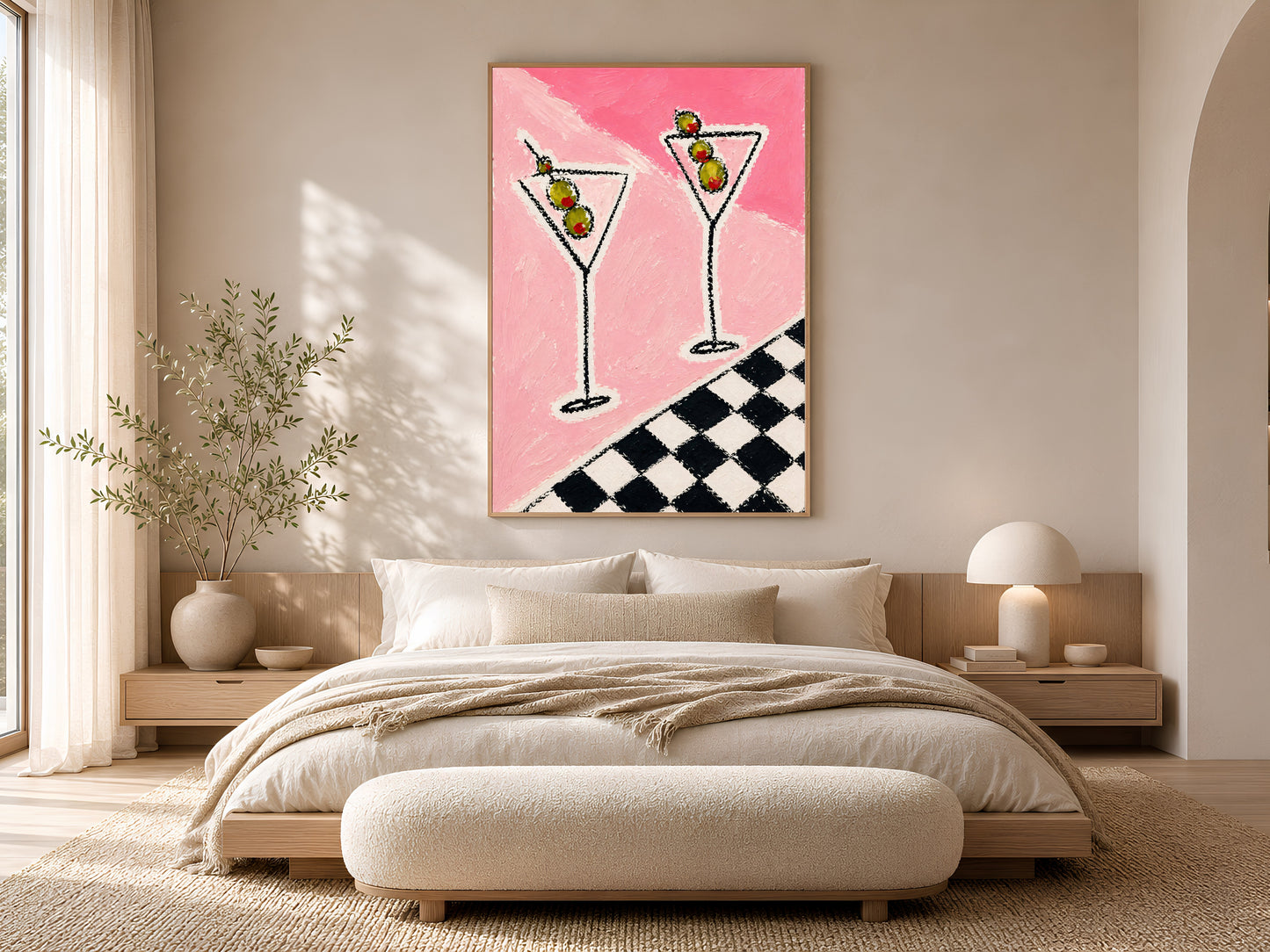 Framed impasto martini print on warm white wall above low platform bed in neutral minimal bedroom with cream bedding

