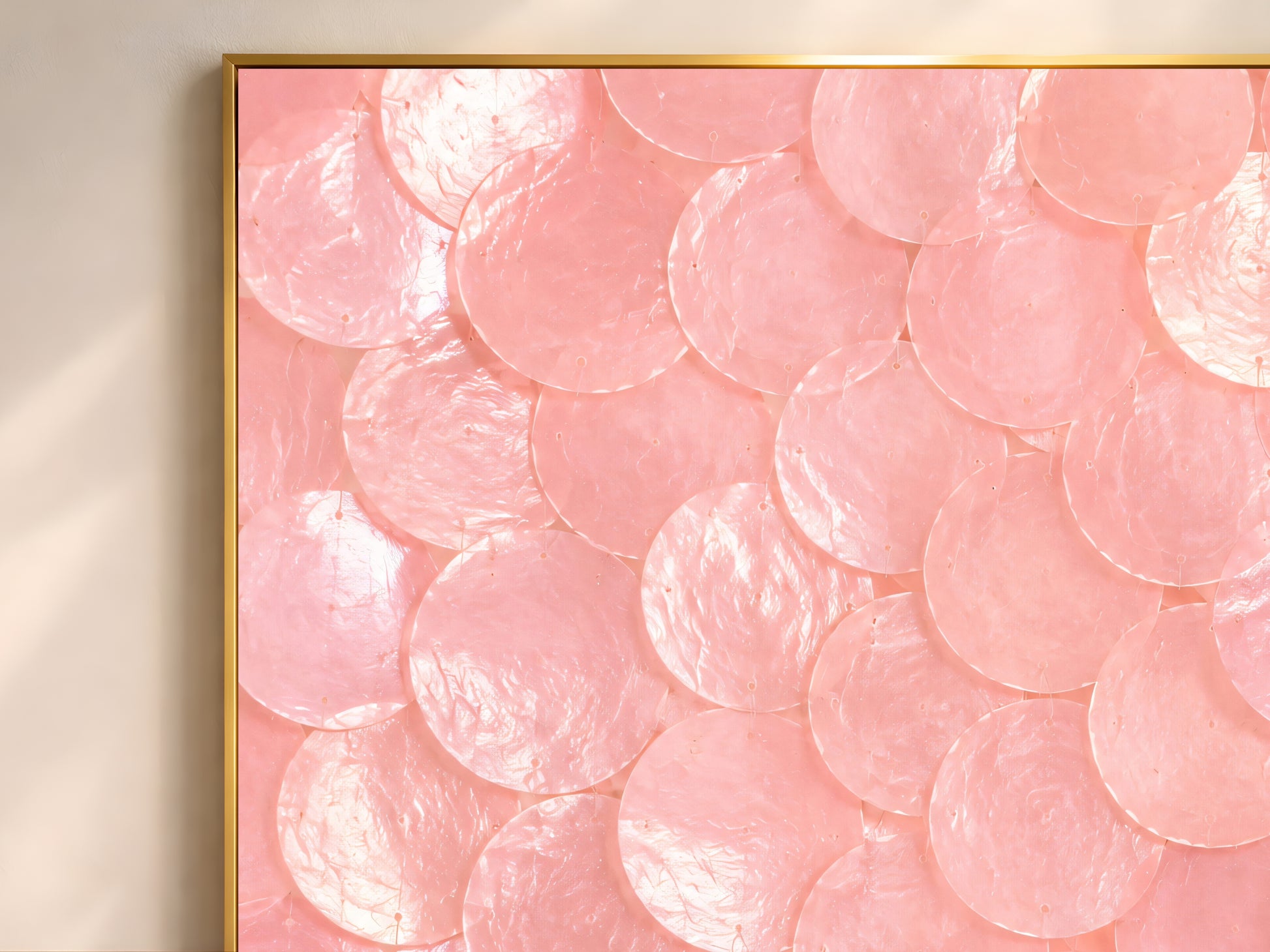 Close-up of pink capiz shell dot mosaic artwork showing pearl and blush pink circle texture.
