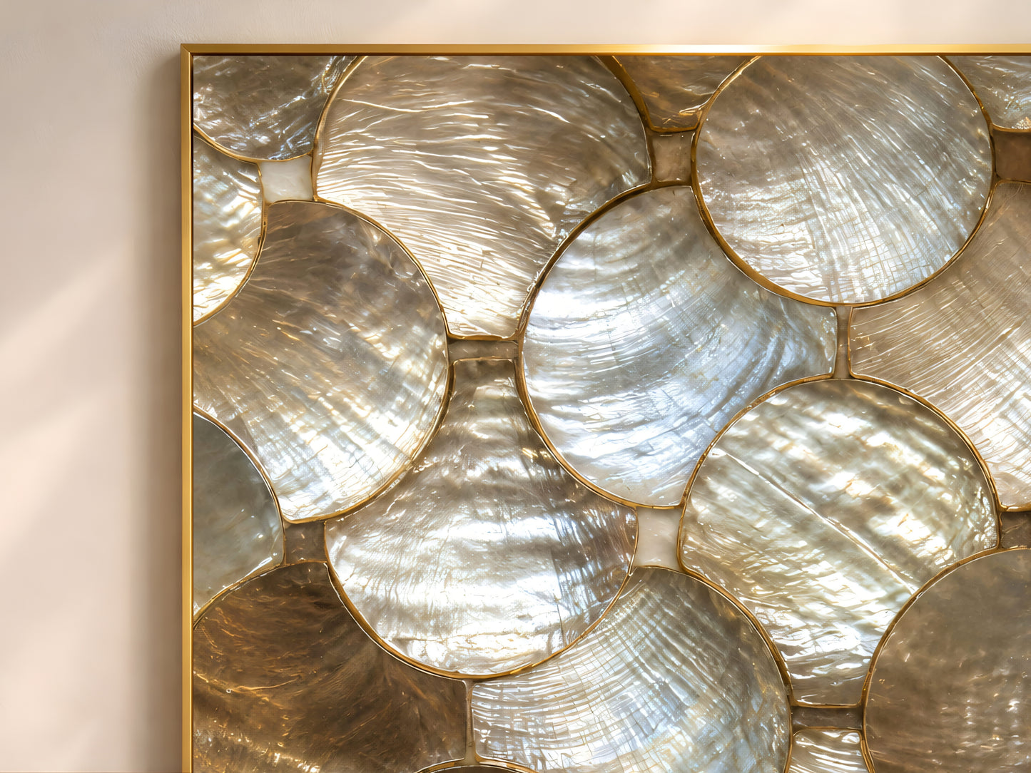Close-up of gold and pearl scalloped abstract wall art print showing its metallic shell-like texture.
