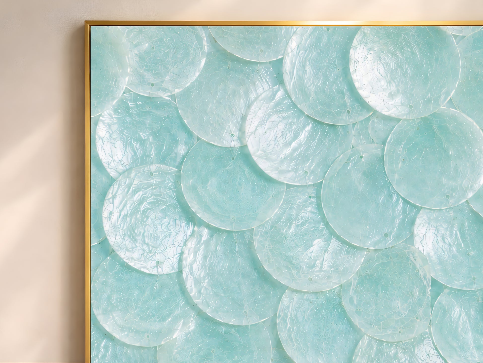 Close-up of seafoam capiz shell mosaic artwork showing aqua and mint shell texture.
