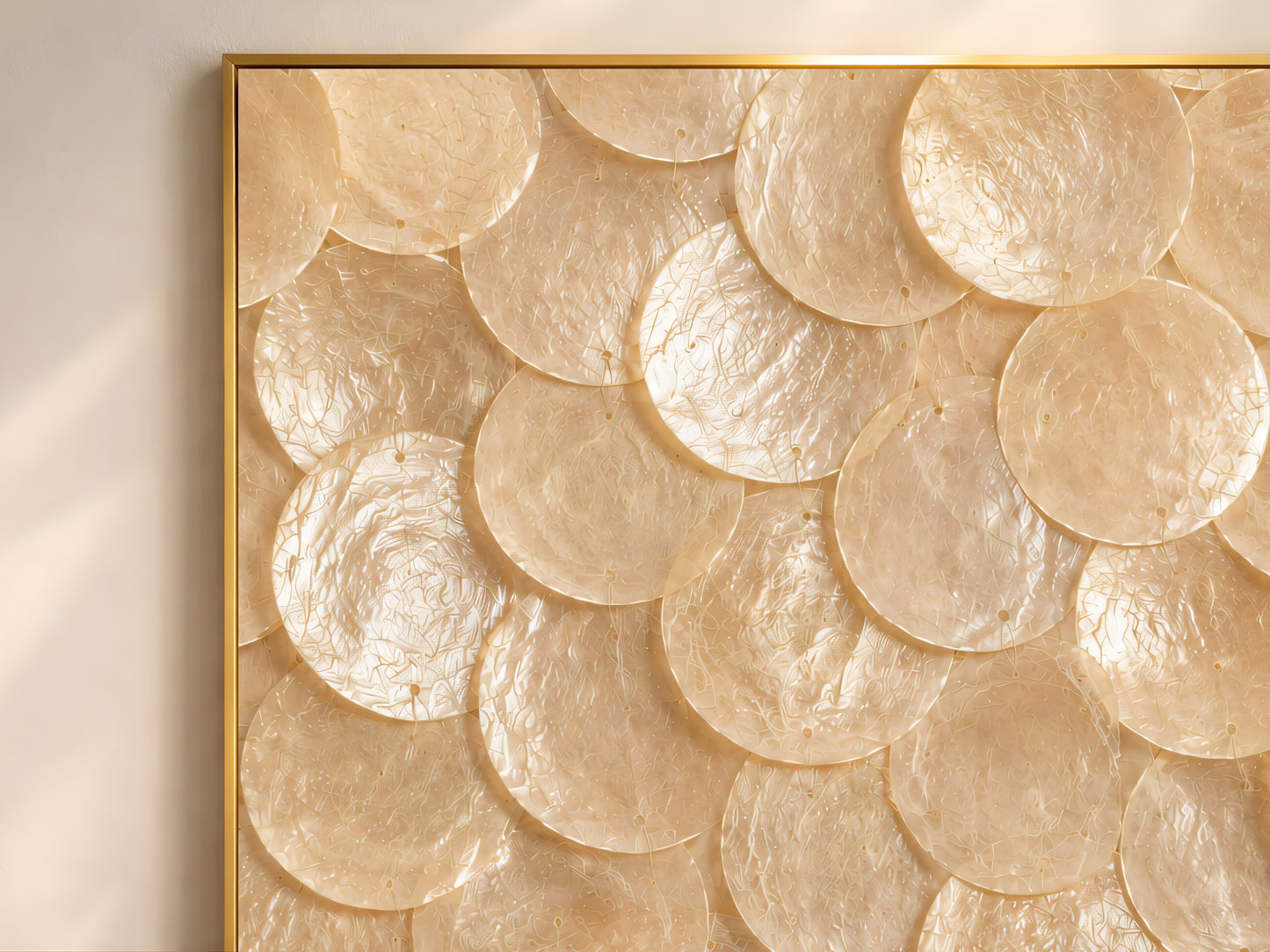 Close-up of natural capiz shell mosaic artwork showing champagne and ivory shell texture.
