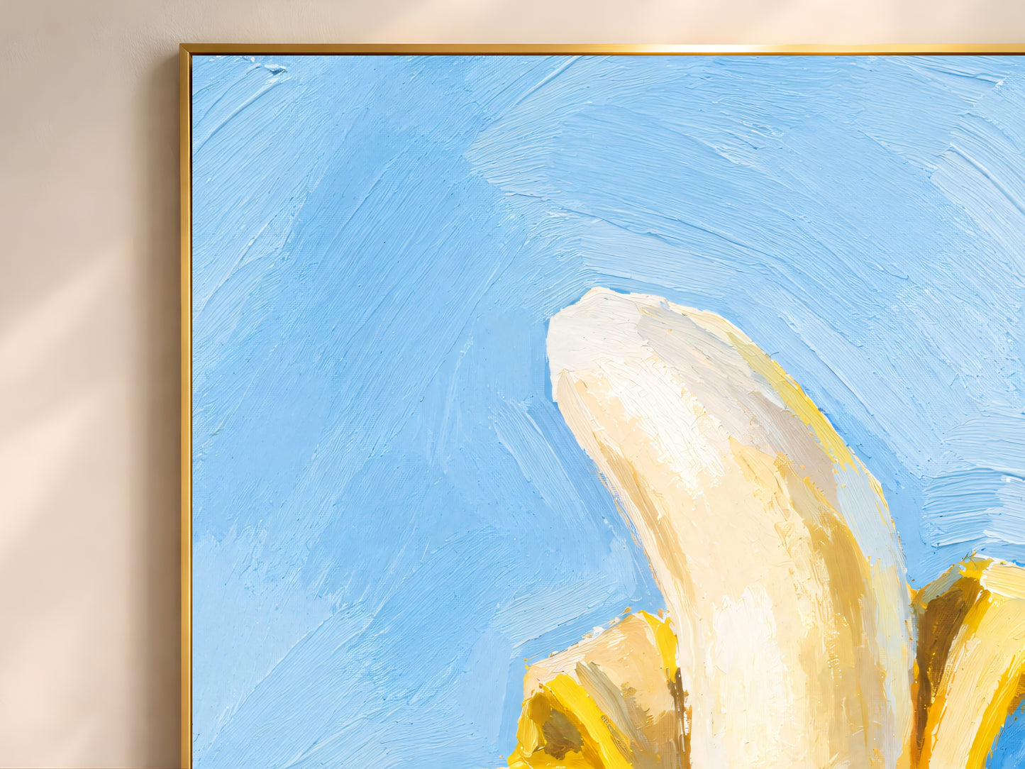Close-up gold frame corner on banana still life oil painting print, light blue background wall art
