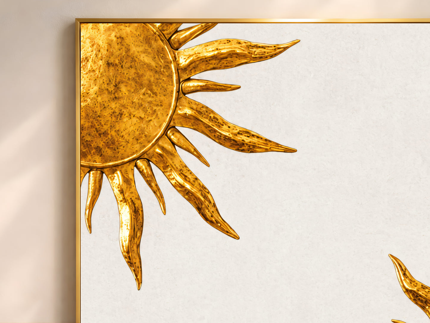 Close-up of gold sunburst wall art, textured antique gold sun medallion print on canvas