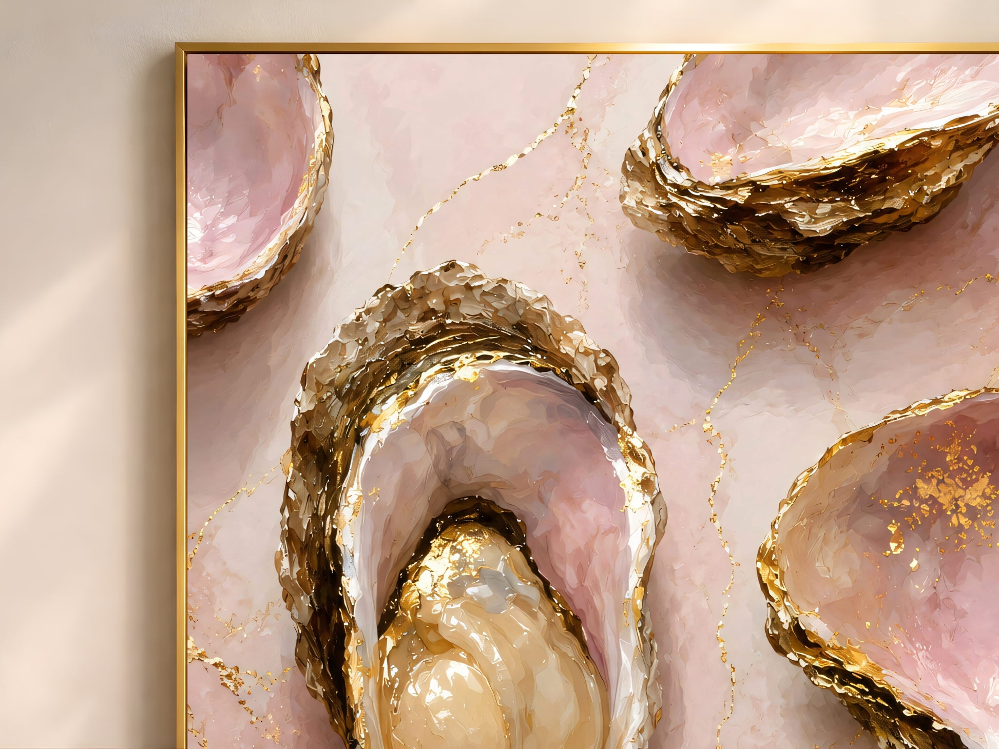Close-up of pink and gold oyster shell painting showing its gold leaf edging and pearl interior.
