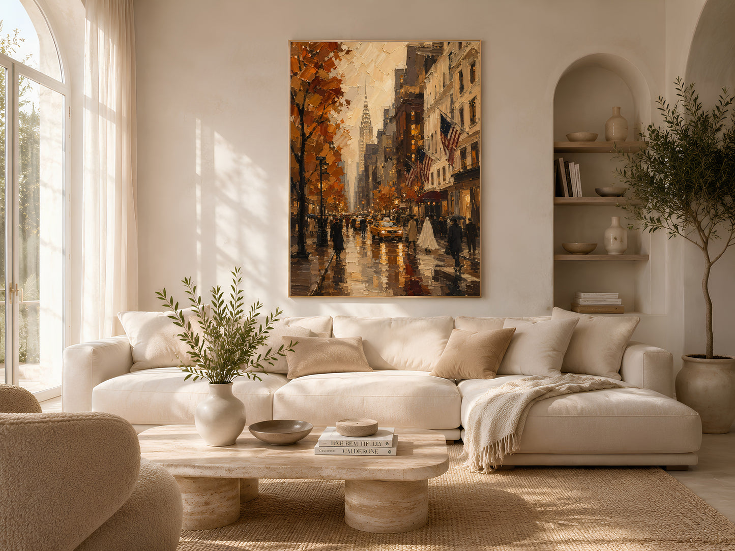 Sunlit living room with the New York City print above a low cream sofa and coffee table near arched windows