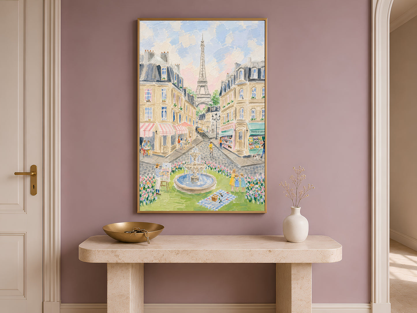 Impasto Paris street scene wall art in a gold frame above a travertine console with a cream vase against a dusty mauve wall in a warm minimal entryway
