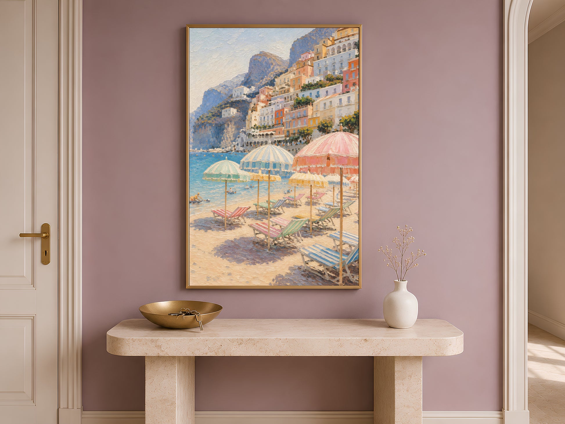 Framed Positano print on a console table in a mauve entryway