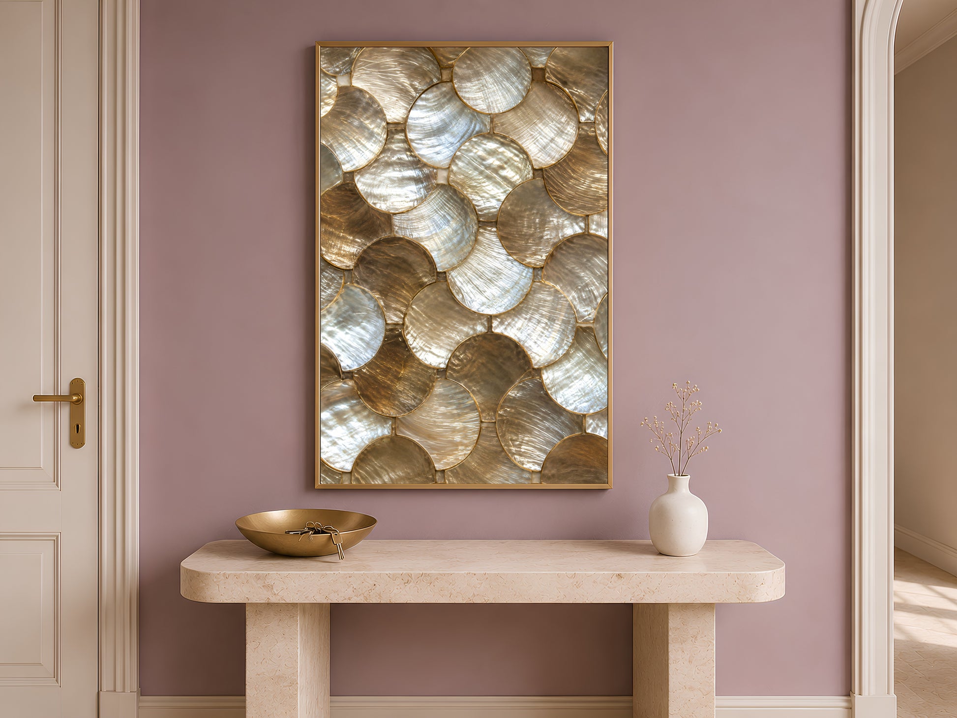 Gold abstract wall art print in a gold frame above a console table against a mauve wall.
