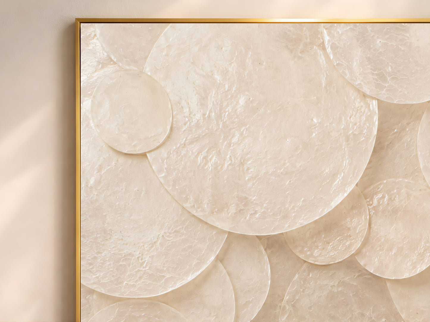 Close-up of overlapping capiz shell circles in soft ivory and cream tones
