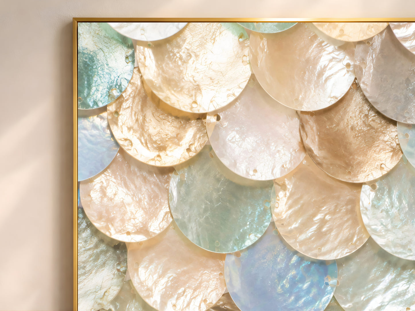 Close-up of pastel iridescent mother of pearl print showing seafoam, gold, and opal scalloped shell texture